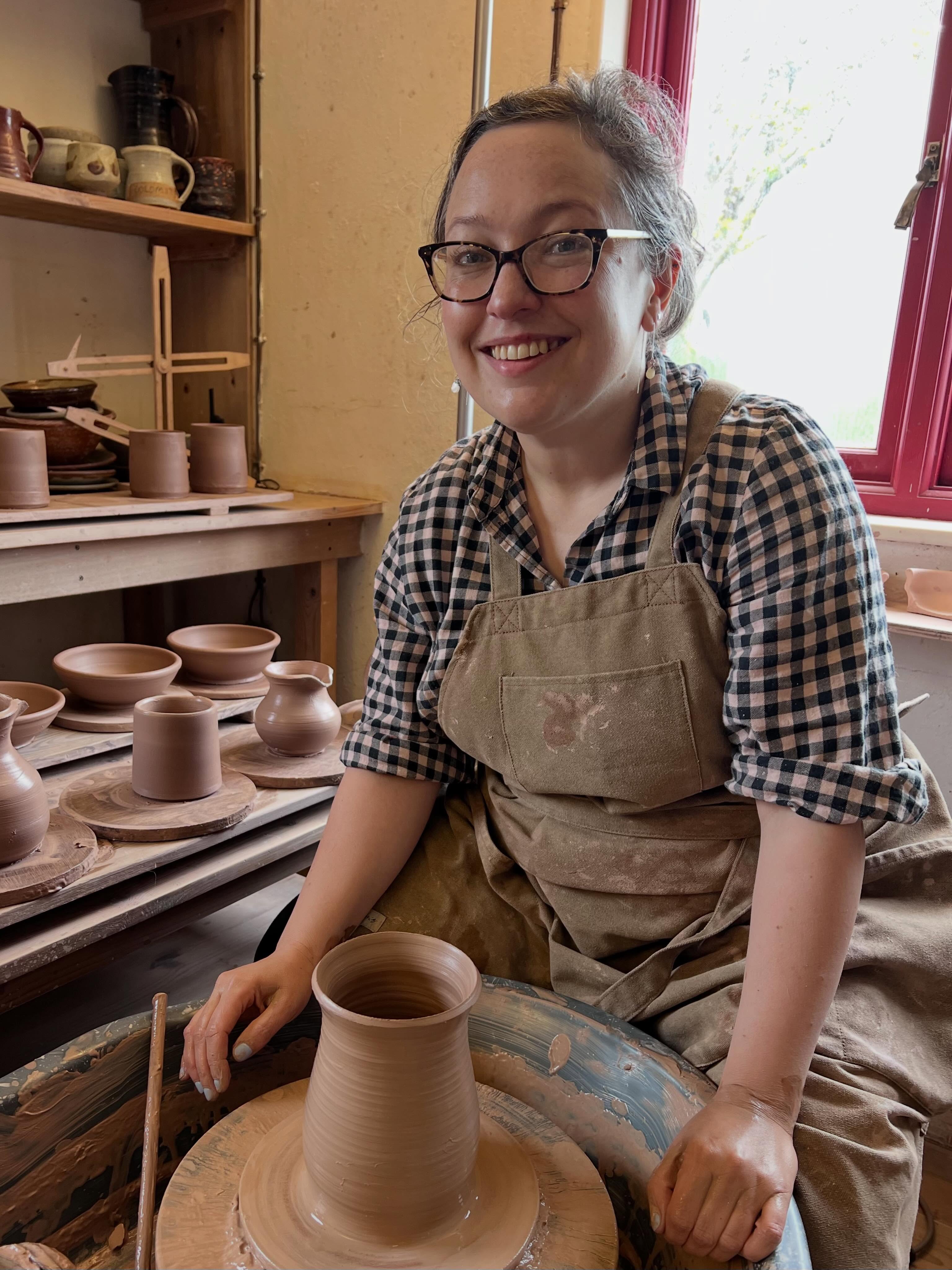 Sarah Fisher at her pottery wheel